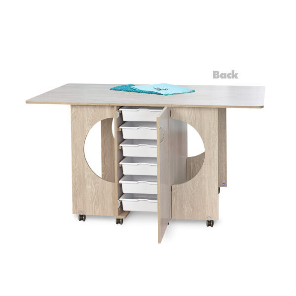 Cutting Table in Grey Oak from Tailormade Sewing Furniture shown from rear to showcase storage cubbies - available at Sewing Center. Cutting Table features an expansive cutting worksurface, front and back storage, and efficient gatelegs. Now with hassle-free home delivery.