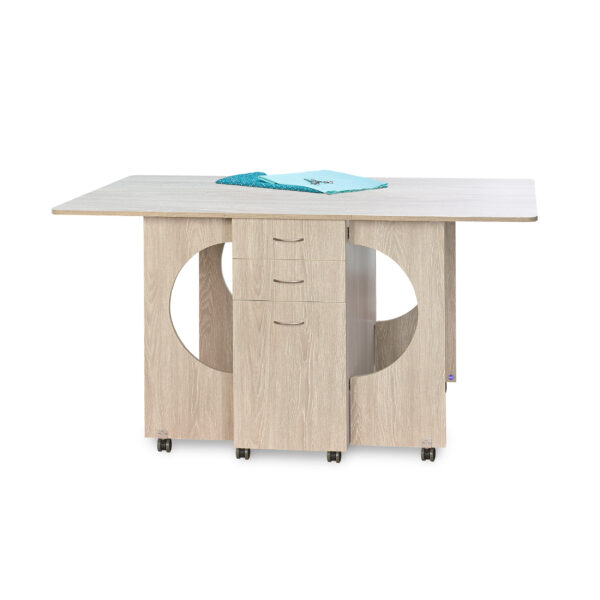 Cutting Table in Grey Oak from Tailormade Sewing Furniture shown in open position - available at Sewing Center. Cutting Table features an expansive cutting worksurface, front and back storage, and efficient gatelegs. Now with hassle-free home delivery.