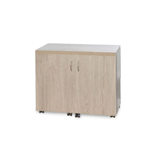 Duo Sewing Cabinet in Grey Oak from Tailormade Sewing Furniture shown in closed position - available at Sewing Center. Duo features flat bed sewing, a glide-out thread closet, and in-door notion storage. Now with hassle-free home delivery.